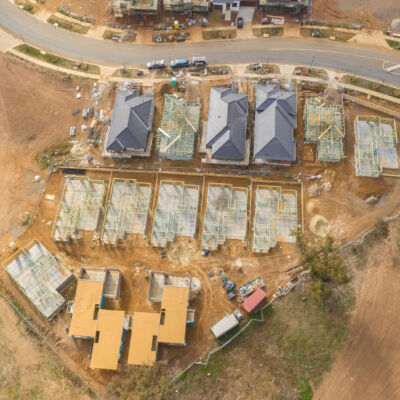 Aerial view of housing development and construction in a newly established suburb in the area of Ginninderry in Canberra, Australia